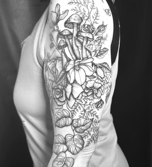Botanical fine-line sleeve tattoo by Eden Tattoo Gallery