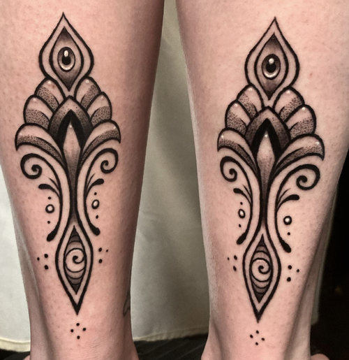 Fine line ornamental tattoo